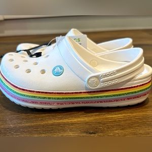 NWT Crocs. White with rainbow stripe